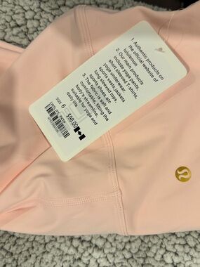 Lululemon Pink Athletic Leggings with Gold Logo